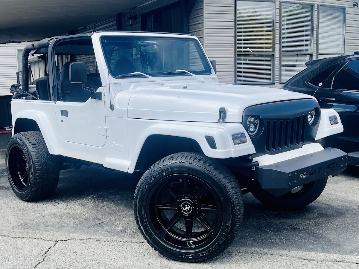 Custom white Jeep Wrangler on black wheels