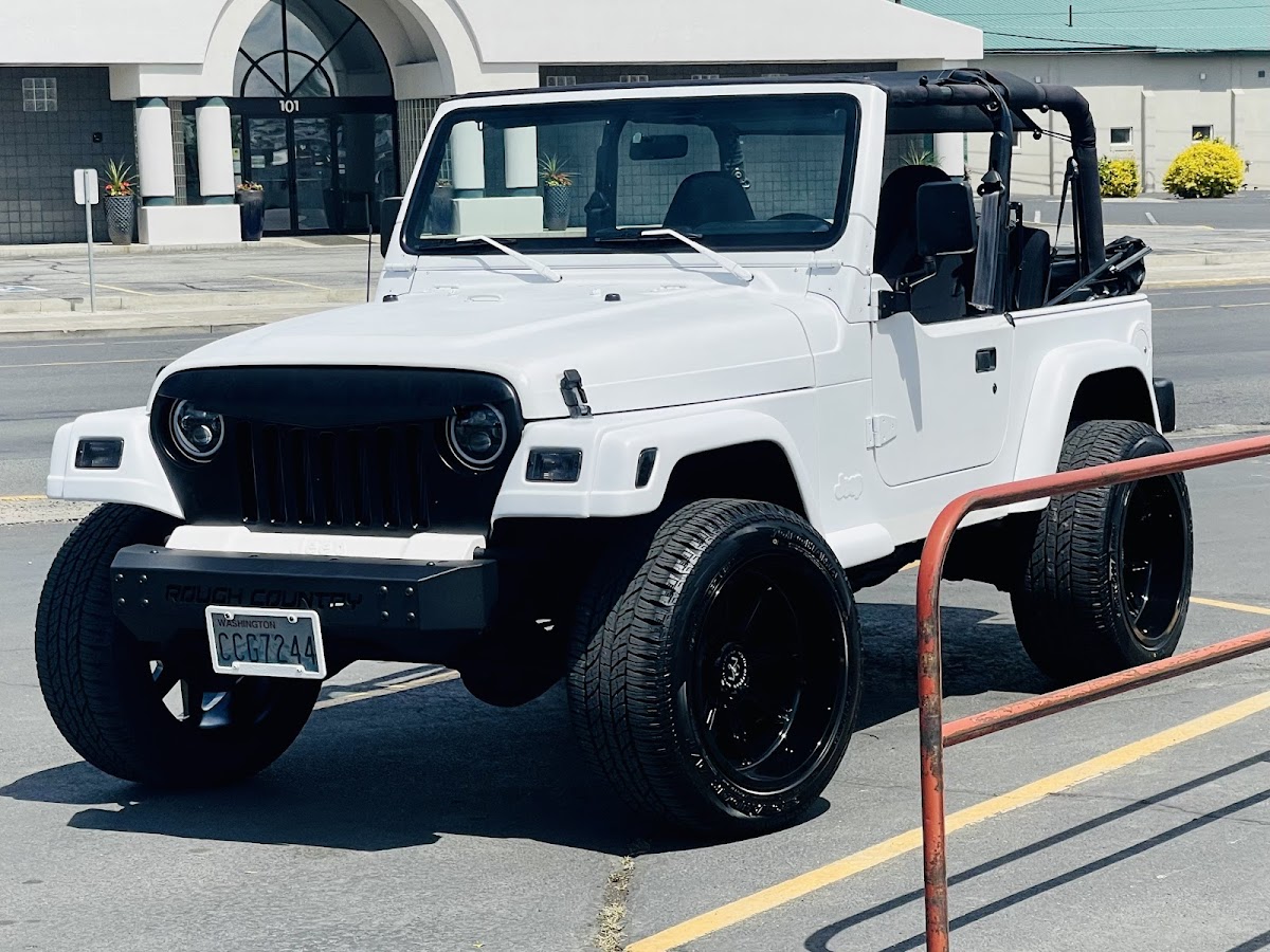 Lifted white Jeep Wrangler, custom build